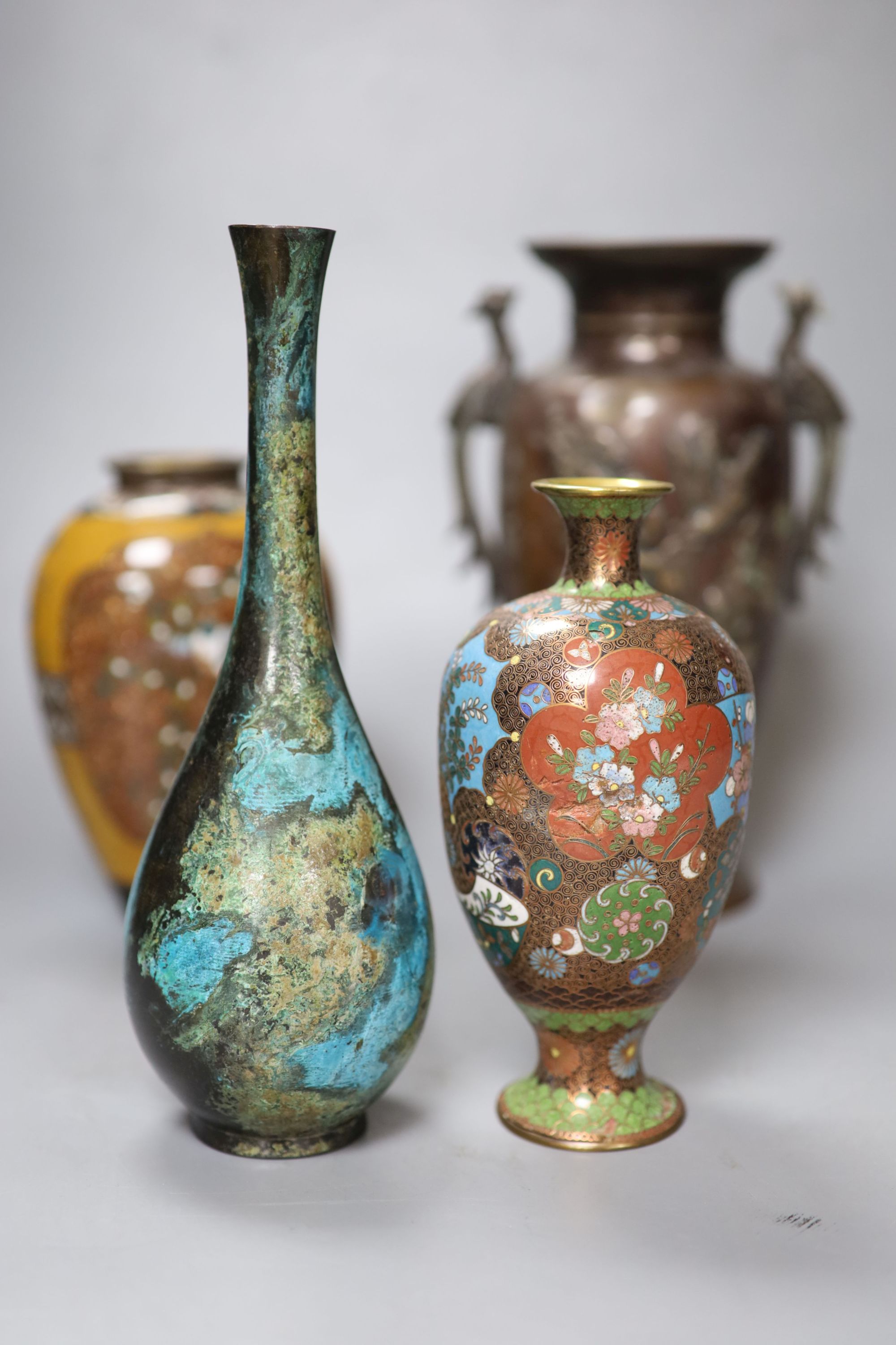 Seven Japanese vases including one bronze, five cloisonne enamel and a patinated bronze bottle vase, tallest 22cm